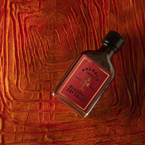 Bourbon Barrel Foods Bourbon Smoked Soy Sauce creative bottle shot.